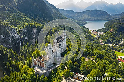 Aerial view on Neuschwanstein Castle Schwangau, Bavaria, Germany. Drone picture on Alpsee lake in Alps mountains Stock Photo