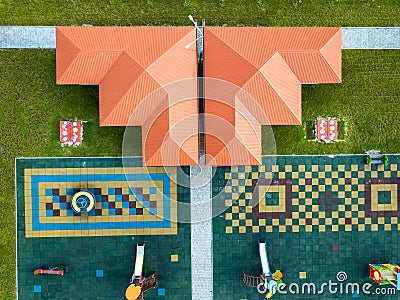 Aerial view of new alcove in kindergarten play yard with red tiled roof for outdoor children activities Stock Photo