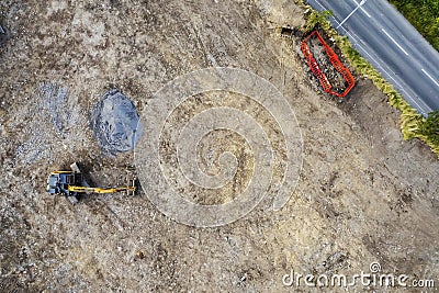 Aerial view on a new construction site . Ground work with excavator. Starting new project. Building industry. Commercial or Editorial Stock Photo