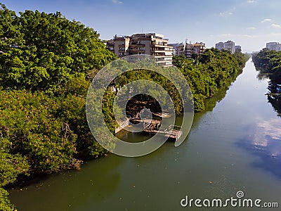 Aerial view o Marapendi canal in Barra da tijuca on a summer day. There is wooden dock, with green vegetation can be Stock Photo
