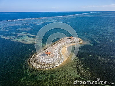 Aerial view of an offshore gazebo sheltered by a large, fringing tropical coral reef Stock Photo