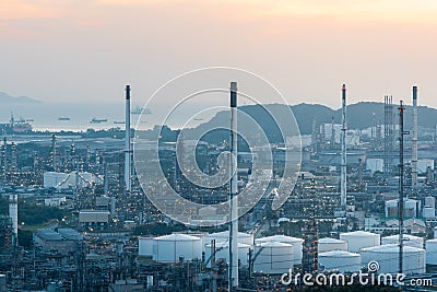 Aerial view of Oil and gas industry - refinery at sunset - factory - petrochemical plant, Shot from drone of Oil refinery and Stock Photo