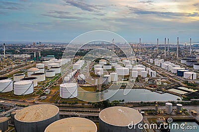 Aerial view oil storage tank with oil refinery background, Oil refinery plant at night Stock Photo