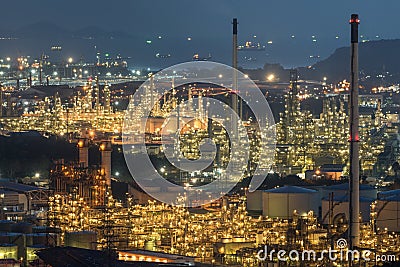 Aerial view oil storage tank with oil refinery background, Oil refinery plant at night Stock Photo