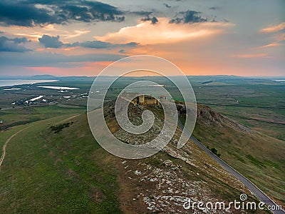 Aerial view of the old Enisala stronghold citadel standing on the hill in the sunset Stock Photo