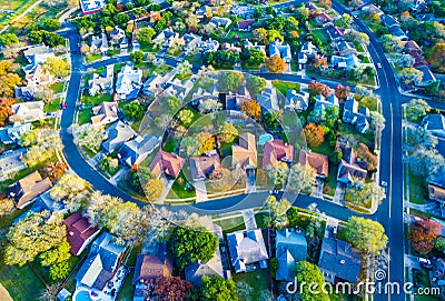 Aerial View Over Modern Suburb Home Community with Fall Colors Curved Streetes Stock Photo
