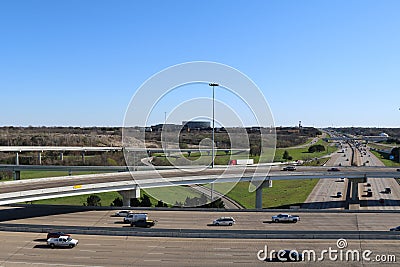 An aerial view overlooking multiple lanes of freeway interstate highway traffic and blue sky Editorial Stock Photo