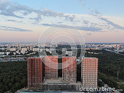 Aerial view panoramic landscape of Moscow city at sunrise. Modern houses in the rays of the golden sun. Drone shot Stock Photo