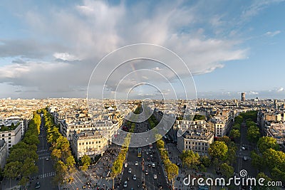 Aerial view of Paris City and the Avenue des Champs-Elysees with a rainbow among the city Stock Photo