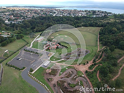 Aerial view of a parking lot near a baseball field, enclosed by lush trees Stock Photo