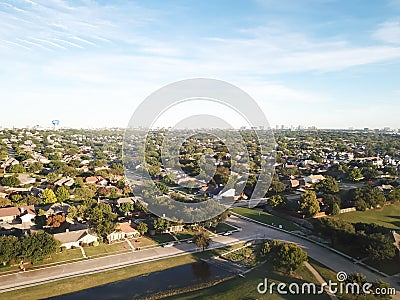 Aerial view parkside residential neighborhood with midtown Dallas skylines in background near Carrollton, Texas, America Stock Photo