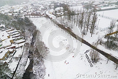 Aerial view of people playing on sledges during a snowstorm (Ebbw Vale, Wales Stock Photo