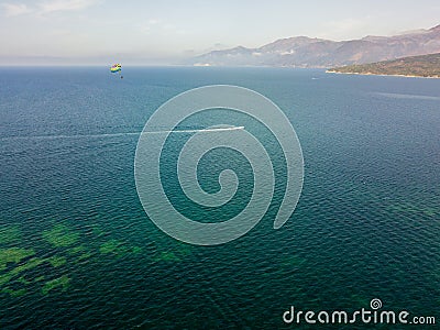 Aerial view of people practicing parasaling, parachutes dragged by a motorboat Stock Photo