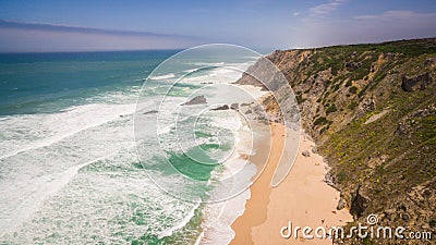 Aerial view of peoples resting on Praia da Adraga beach in Portugal, Almocageme, Sintra Stock Photo