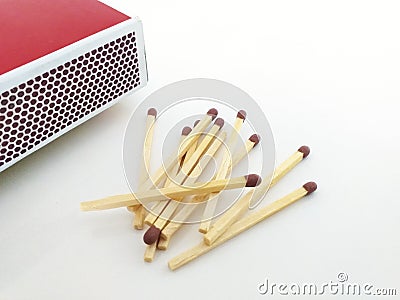 Aerial view of Piles of brown matchstick isolated on white with Matchbox. Wooden rods with a flammable head used to light a fire Stock Photo