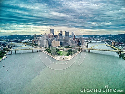 Aerial view of Pittsburgh downtown skyline with bridges on under dramatic sky Editorial Stock Photo