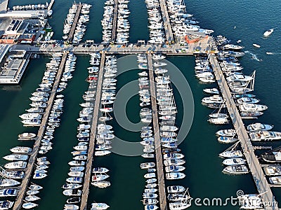 Aerial view of pontoons full of boats and sailboats in the marina. Stock Photo