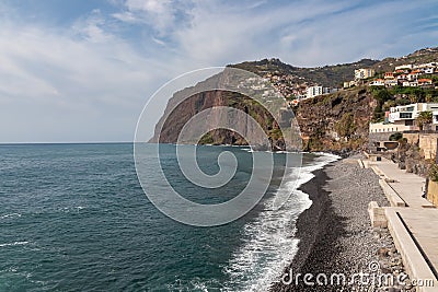 Aerial view of Praia de Vigario in Camara de Lobos on Madeira island, Portugal, Europe. Black stone beach in Atlantic Ocean Stock Photo