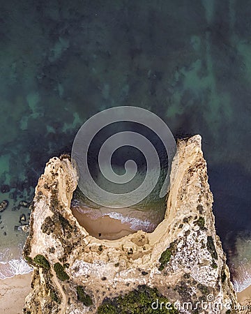 Aerial view of Praia do Buraco, a small paradise beach along the coastline in tthe ALgarve region, Lagoa, Portugal Stock Photo