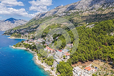 Aerial view of Punta Rata beach with boats and azure sea in Brela, Croatia, Dalmatia, Croatian azure coast Stock Photo