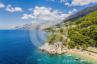 Aerial view of Punta Rata beach with boats and azure sea in Brela, Croatia, Dalmatia, Croatian azure coast Stock Photo