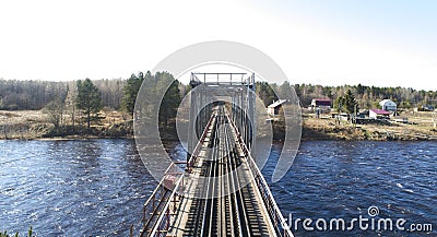 Aerial view on the rail bridge across the river in rural place in spring Stock Photo