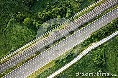 Aerial view, railway and road in rural landscape. Stock Photo