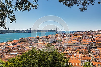 Aerial view of red roofs of Alfama and the River Tagus, Lisbon, Stock Photo