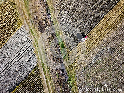 Aerial view of Tractor harrowing soil Stock Photo