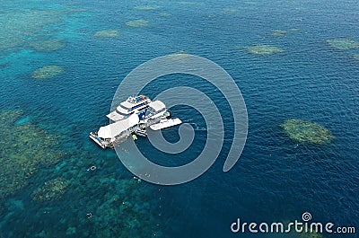 Aerial view of reef with marine diving platform and boats at the Stock Photo