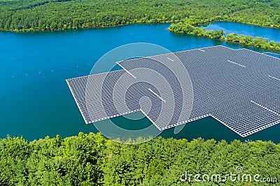 Aerial view of renewable alternative electricity energy the floating solar panels cell platform on the beautiful lake Stock Photo