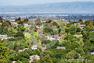 Aerial view of residential neighborhood; San Francisco bay visible in the background; Redwood City, California Stock Photo