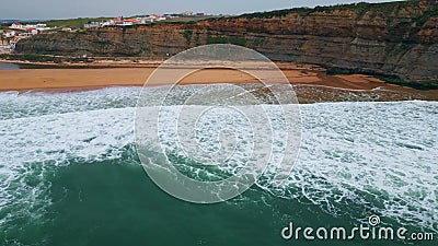 Aerial view rippling ocean waves washing beach. Sea surf covering empty seashore Stock Photo