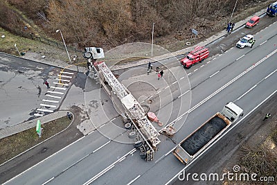 Aerial view of road accident with overturned truck blocking traffic Stock Photo