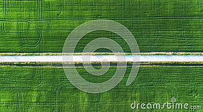 Aerial view at the road and field. Agricultural landscape from air. Field and road. Farm at summer time. Drone photography Stock Photo