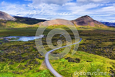 Aerial view on road in Iceland. Aerial landscape above highway in the geysers valley. Icelandic landscape from air. Famous place. Stock Photo