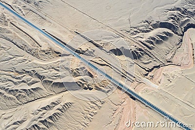 Aerial view of road on wind erosion terrain in qinghai Stock Photo