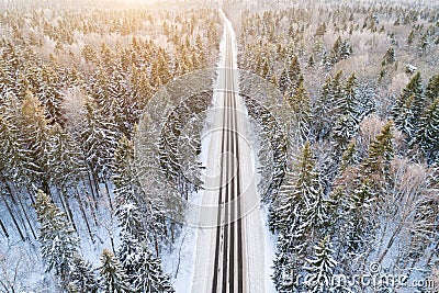 Aerial view of road in winter forest Stock Photo