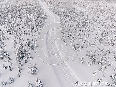 Aerial view of the road in the winter snow forest in Finland Stock Photo