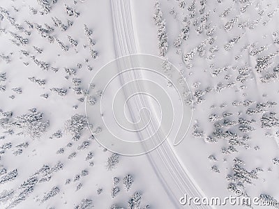 Aerial view of the road in the winter snow forest in Finland Stock Photo