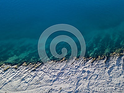 Aerial view of rocks on the sea. Overview of the seabed seen from above, transparent water Stock Photo