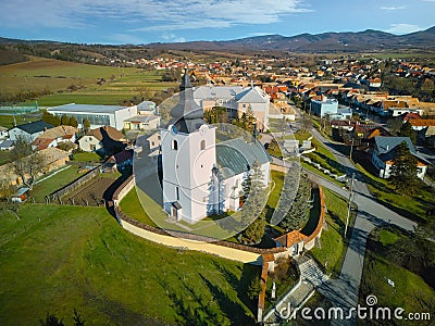 Aerial view of Roman Catholic Church of All Saints in Ocova in podpolanie region during winter Stock Photo