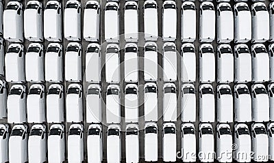 Aerial view of rows of newwhite vans parked together Stock Photo