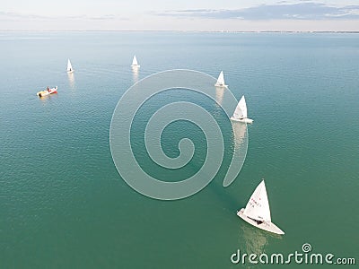 Aerial view of sailboats floating on the sparkling blue ocean Stock Photo