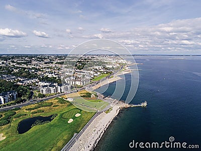 Aerial view on Salthill, Galway city, Ireland, Tilt shift effect, Blackrock diving board, Warm sunny day. People swimming in the Stock Photo