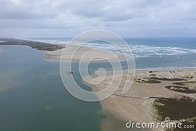 Aerial view of a sand dredger boat at the mouth of the Murray River in South Australia Stock Photo