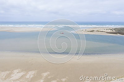 Aerial view of a sand dredger boat at the mouth of the Murray River in South Australia Stock Photo