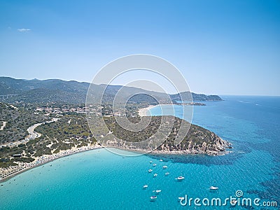 Aerial view of sardinia shoreline with boat and crystal clear blue turquoise sea - Mari pintau - Painted Sea TRAVEL in SARDINIA Stock Photo