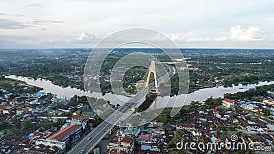 Aerial view of Siak Bridge IV Abdul Jalil Alamuddin Syah Bridge above Siak River Sungai Siak in Pekanbaru top view. Pekanbaru Editorial Stock Photo