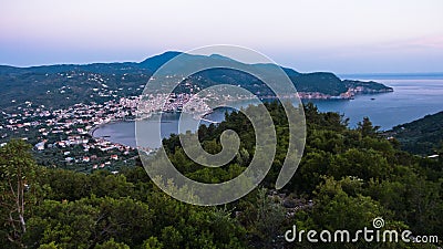 Aerial view of Skopelos harbour and town before sunrise, island of Skopelos Stock Photo